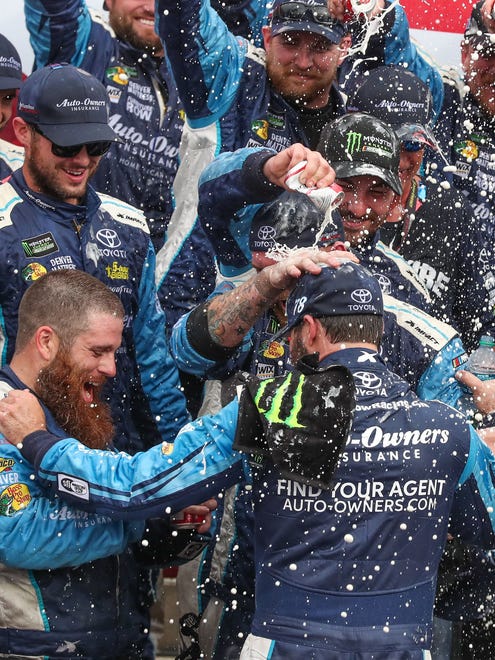 Martin Truex Jr. and his crew, which performed nearly flawlessly during the Bank of America 500 on Oct. 8, 2017, celebrate his win at Charlotte Motor Speedway to kick off the second round of the playoffs. The win was his sixth of the year.