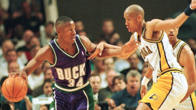 Ray Allen and Reggie Miller lock arms in the first quarter of the first round of the Eastern Conference playoffs.