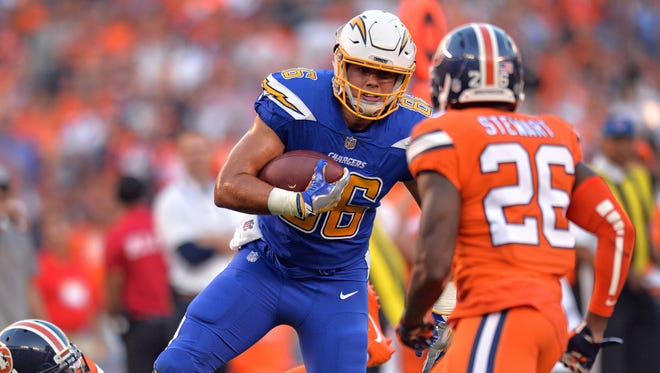 San Diego Chargers tight end Hunter Henry (86) is defended by Denver Broncos free safety Darian Stewart (26) during the first quarter at Qualcomm Stadium.