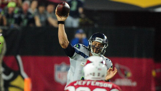 Seahawks quarterback Russell Wilson (3) throws against the Cardinals.