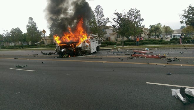 Flames engulf a truck driven by Reynaldo Lugo after a car hits it head on in Oxnard in early January.