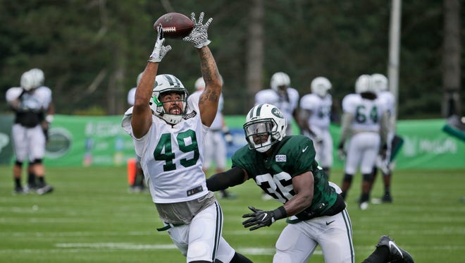 New York Jets tight end Jordan Leggett, left, tries to make a catch while Doug Middleton defends during training camp in Florham Park, N.J., Tuesday, Aug. 8, 2017.