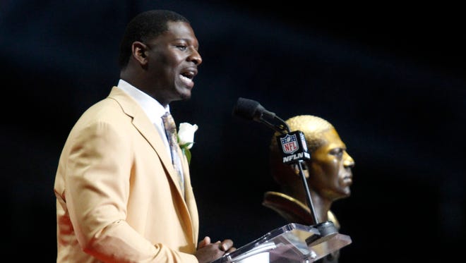 Former San Diego Chargers running back LaDainian Tomlinson delivers his acceptance speech during the Pro Football Hall of Fame enshrinement ceremonies at the Tom Benson Hall of Fame Stadium.