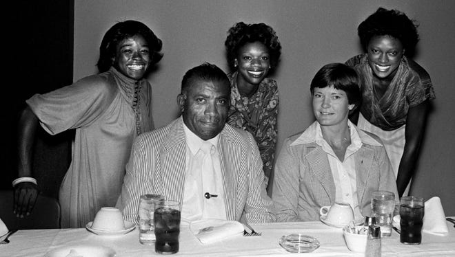 Tennessee State women's track coach Ed Temple, front left, and Tennessee women's basketball coach Pat Head, talk about the 1980 Olympics as three of Temple's Tigerbelles, Kathy McMillan, back left, Brenda Morehead and Chandra Cheeseborough, looks on during a Cable Club meeting in Nashville Sept. 12, 1979.