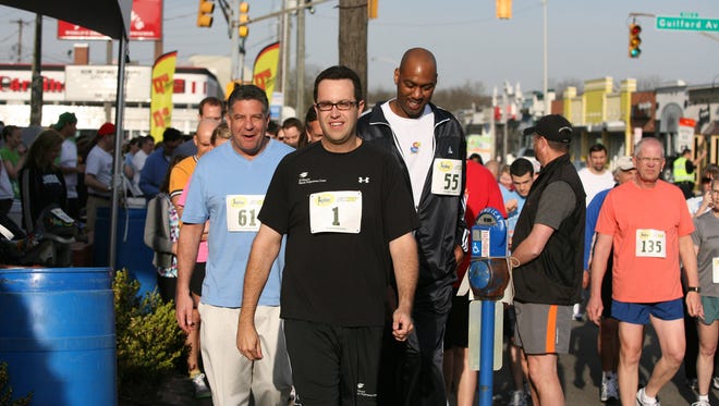 Jared Fogle (center), Hometown Hero and SUBWAY Spokesperson, leads the way to the "Subway Fun Run" in Indianapolis Friday, April 2, 2010.  To the left is Bruce Pearl (blue shirt), former men's basketball coach of the Tennessee Volunteers and to the right is Danny Manning, former NBA All-Star and former assistant coach of the Kansas Jayhawks.