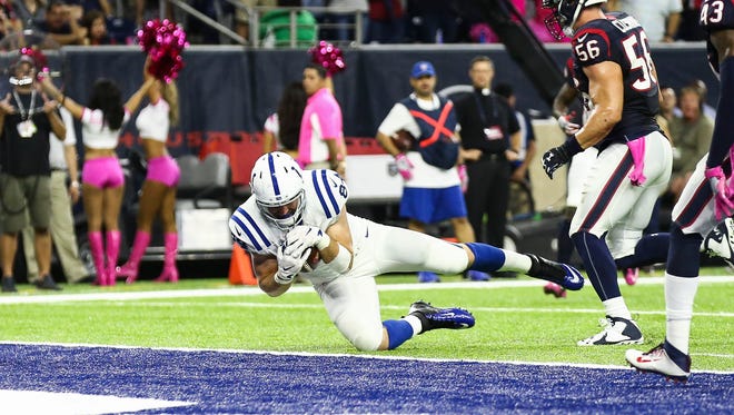 Colts tight end Jack Doyle (84) dives into the end zone for a touchdown during the second quarter against the Texans.