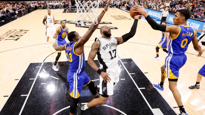 Golden State Warriors point guard Patrick McCaw blocks a shot attempt by San Antonio Spurs shooting guard Jonathon Simmons during the second half in Game 4 of the Western Conference finals.