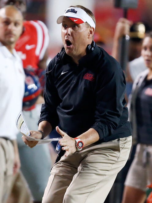 Mississippi coach Hugh Freeze reacts to an official's call in the first half of an NCAA college football game against LSU in Baton Rouge, La., Saturday, Oct. 25, 2014. (AP Photo/Jonathan Bachman)
