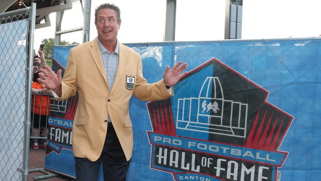 Former Miami Dolphins quarterback Dan Marino enters the stadium for the Pro Football Hall of Fame enshrinement ceremonies at the Tom Benson Hall of Fame Stadium.