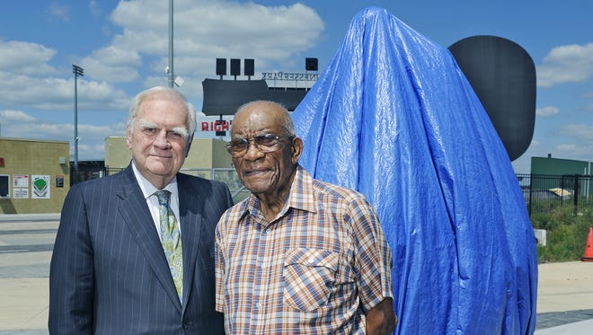 Bo Roberts, left, who has worked 15 years to get a statue to honor his friend, legendary TSU coach Ed Temple, right, pose with it Aug. 26, 2015. It'll be unveiled Aug. 28 outside right field at First Tennessee Park.