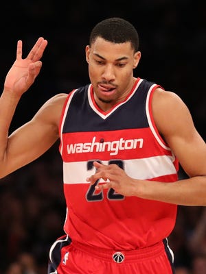 Washington Wizards forward Otto Porter Jr. (22) gestures after a three point basket during the third quarter against the New York Knicks at Madison Square Garden.