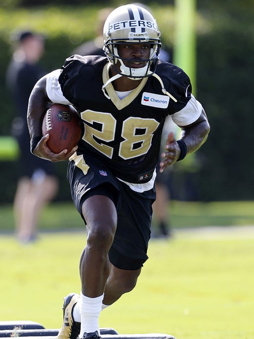 Saints RB Adrian Peterson  runs through a drill during training camp in Metairie, La., Thursday, July 27, 2017.