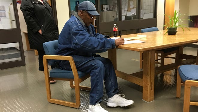 Simpson signs documents at the Lovelock Correctional Center, Saturday, Sept. 30, 2017, in Lovelock, Nev. Simpson was released from the Lovelock Correctional Center in northern Nevada early Sunday, Oct. 1, 2017.