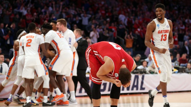 Wisconsin guard Zak Showalter reacts after Florida beat the Badgers at the buzzer in overtime of their game in the Sweet 16 of the NCAA tournament at Madison Square Garden in New York.