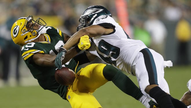Green Bay Packers' Malachi Dupre drops the ball as he is hit hard by Philadelphia Eagles' Tre Sullivan in the second half Thursday, August 10, 2017, at Lambeau Field in Green Bay, Wis. Dupre was carted off the field.