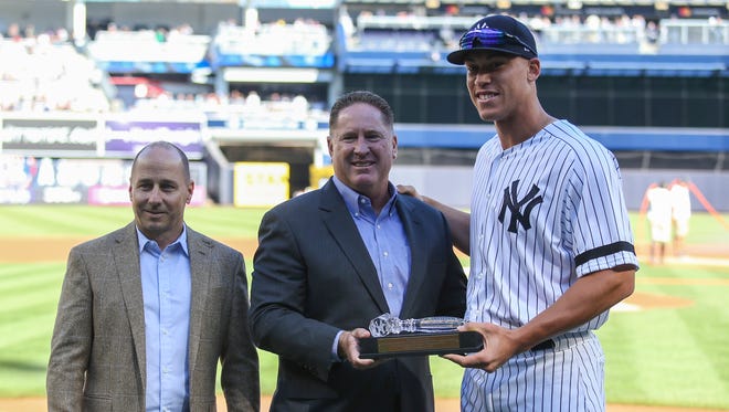 Oct. 1: Aaron Judge is presented with an award for his rookie home run record (52) before the last game of the season.