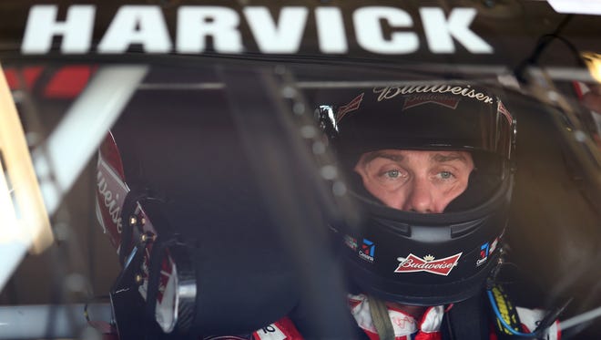 Kevin Harvick prepares to drive during practice for the NASCAR Sprint Cup Series Quaker State 400 at Kentucky Speedway on June 28, 2013.