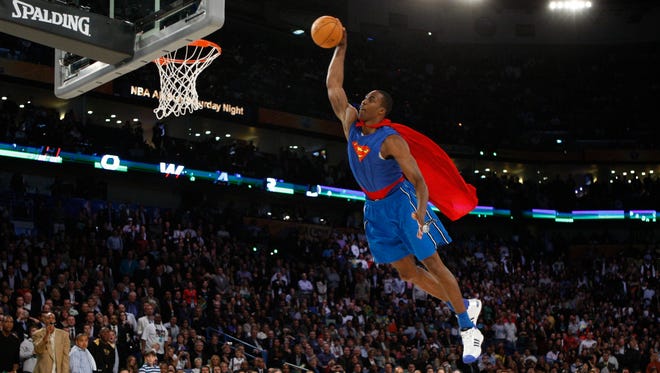 2008: Dwight Howard attempts a dunk from the free throw line with Superman outfit on. Howard's showmanship would lead to a victory in the contest.