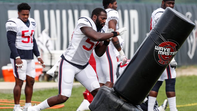 Houston Texans outside linebacker Whitney Mercilus (59) hits a tackling dummy during training camp at The Greenbrier, Saturday, Aug. 12, 2017, in White Sulphur Springs, W. Va.
