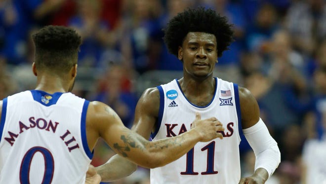 Kansas Jayhawks guard Josh Jackson (11) reacts with guard Frank Mason III (0) during the second half against the Purdue Boilermakers in the semifinals of the midwest Regional of the 2017 NCAA tournament at Sprint Center.