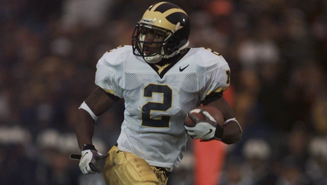 Michigan's Charles Woodson scores on a touchdown pass against Penn State in 1997.