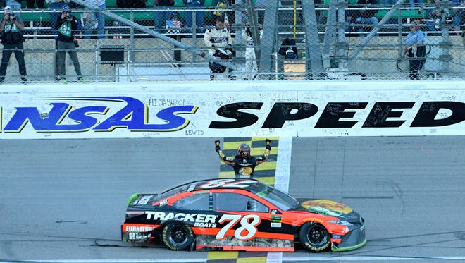Martin Truex Jr. (78) celebrates after winning the 2017 Hollywood Casino 400 at Kansas Speedway. The win was Truex's second on the season at Kansas, third win in the playoffs and seventh win overall.