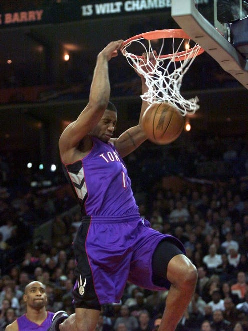 2000: Tracy McGrady throws down a dunk during the 2000 Slam Dunk Contest. Despite that, he would fall to his cousin, Vince Carter, in the competition.