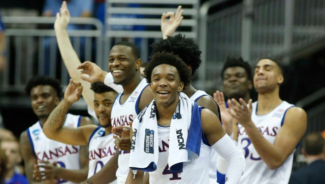 Kansas players celebrate their win over Purdue in the Sweet 16.