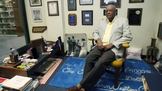 Ed Temple, one of the countryÕs most heralded track and field coaches, poses with an exhibit of his Tigerbelles at Tennessee State University library May 17, 2007. He was the coach at TSU for 44 years.