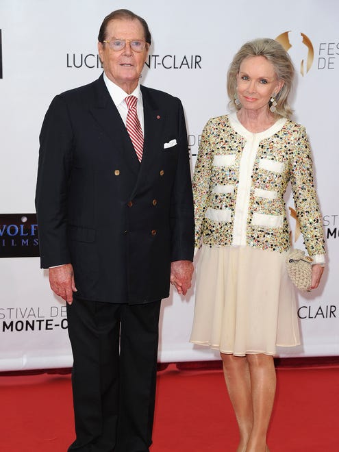 Roger Moore and his wife Kristina Tholstrup arrive at the opening ceremony of the 2012 Monte Carlo Television Festival held in Monte-Carlo, Monaco.