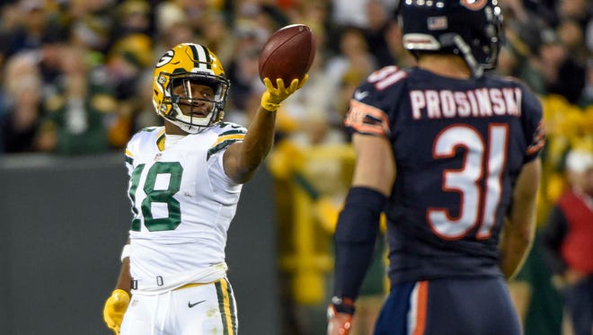 Green Bay Packers wide receiver Randall Cobb (18) reacts after getting a first down in the first quarter during the game against the Chicago Bears at Lambeau Field.