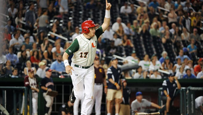 Florida Republican Rep. Thomas Rooney celebrates after scoring the winning run during the annual congressional baseball game at Nationals Park on June 23, 2016.