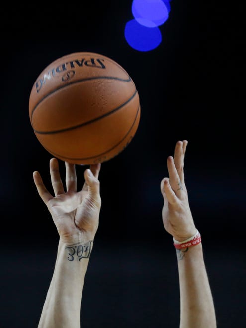 A tattoo is seen on the wrist of Phoenix Suns' Alex Len as he shoot baskets during practice the day before a game against the Dallas Mavericks at Mexico City Arena on Wednesday, Jan. 11, 2017.