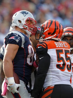 Patriots tight end Rob Gronkowski (87) argues with Bengals linebacker Vontaze Burfict (55) the during the fourth quarter at Gillette Stadium.