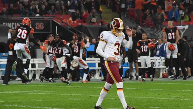 Washington Redskins placekicker Dustin Hopkins (3) reacts after missing a 34-yard field goal in overtime against the Cincinnati Bengals during game 17 of the NFL International Series at Wembley Stadium.