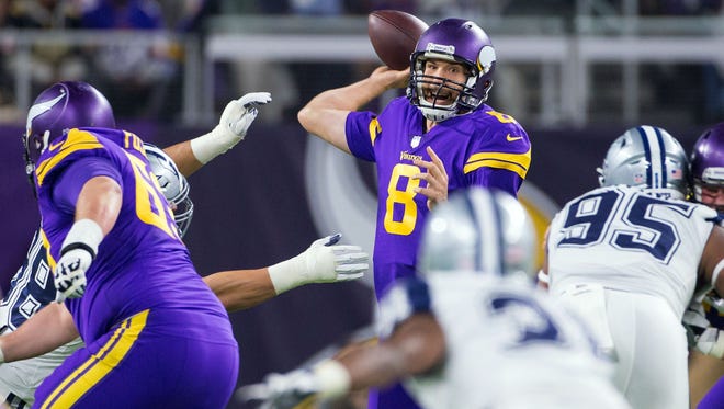 Minnesota Vikings quarterback Sam Bradford (8) passes in the second quarter against the Dallas Cowboys at U.S. Bank Stadium.