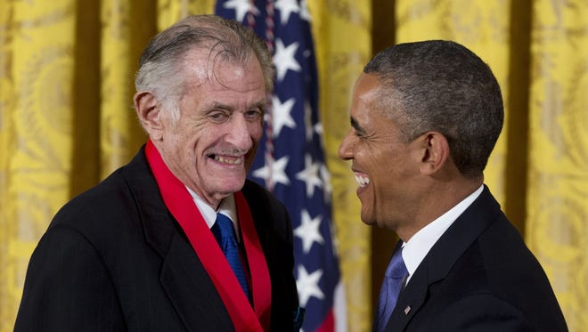 In this 2013, file photo, President Barack Obama laughs with Frank Deford as he awards him the 2012 National Humanities Medal during a ceremony in the East Room of White House.