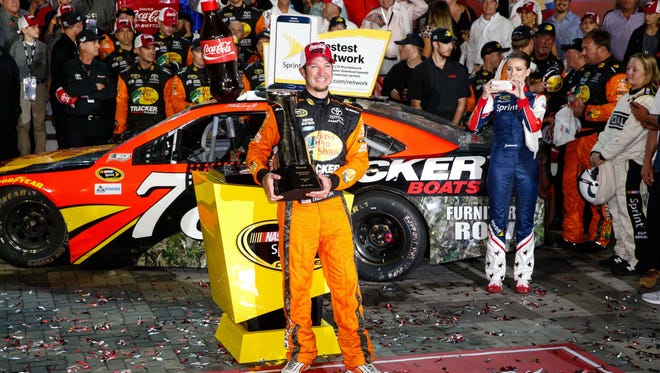 Martin Truex Jr. holds the Bruton Smith trophy after winning the 2016 Coca Cola 600, May 29 at Charlotte Motor Speedway.