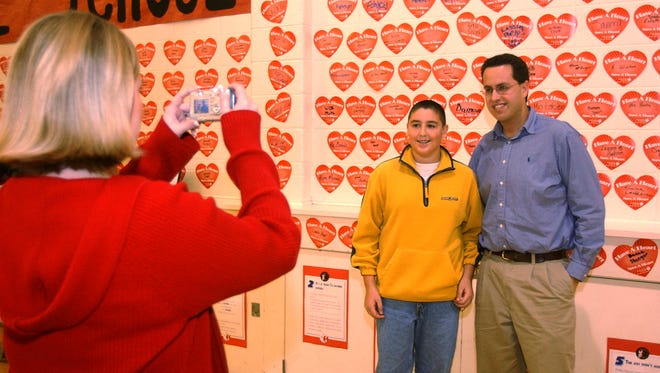 Beech Grove Middle School student Anthony Eagan has his picture taken with Subway spokesman Jared Fogle (right). Fogle came to the school to encourage students to eat right and get exercise.  He at one time weighed 425 pounds which he says was the result of spending too much time playing Nintendo games, etc. He has lost 245 pounds and says that at one time he remembers parking his car at a mall and when he came back to his car was unable to get in because another car had parked next to him. It was a 3 1/2 hour wait for the driver of that car to return and leave the parking spot. His appearance was sponsored by The American Heart Association.