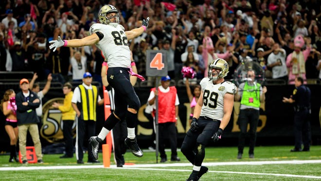 New Orleans Saints tight end Coby Fleener (82) celebrates after a touchdown against the Carolina Panthers during the first quarter of a game at the Mercedes-Benz Superdome.