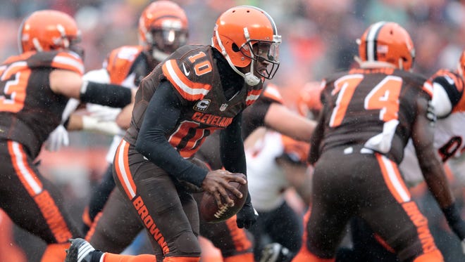 Cleveland Browns quarterback Robert Griffin III (10) rolls out of the pocket in the first quarter during the Week 14 NFL game between the Cincinnati Bengals and the Cleveland Browns, Sunday, Dec. 11, 2016, at FirstEnergy Stadium in Cleveland.