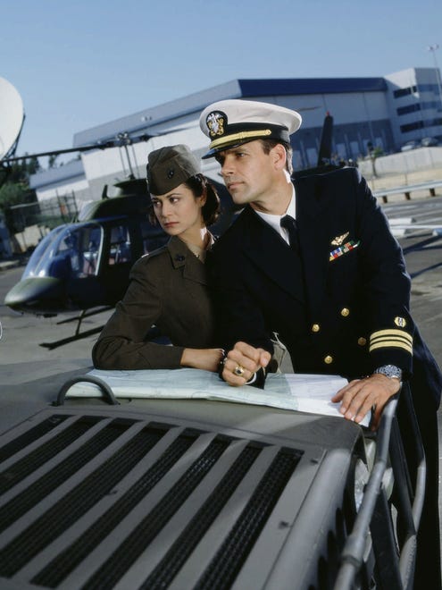 Marine Major Sarah "Mac" MacKenzie  (Catherine Bell) and Lt. Commander Harmon "Harm" Rabb (Daivd James Elliot) of CBS series 'JAG.'