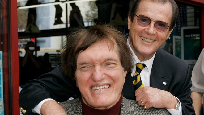 Roger Moore, right, who played the part of James Bond 007 in seven films, poses with actor Richard Kiel who played the role of Jaws in "The Spy Who Loved Me," Oct. 11, 2007.