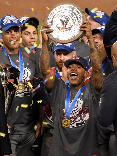 Marcus Stroman holds up the most valuable player award after pitching the Americans to a win over Puerto Rico in the finals of the World Baseball Classic at Dodger Stadium.
