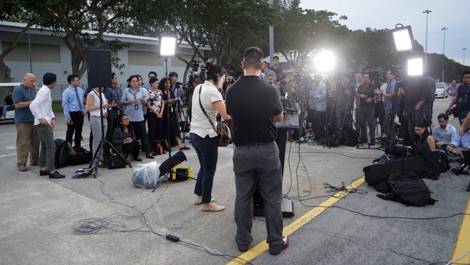 Members of the press wait for a press conference with Commander of the U.S. Pacific Fleet Scott Swift at Singapore's Changi naval base  Aug. 22, 2017.