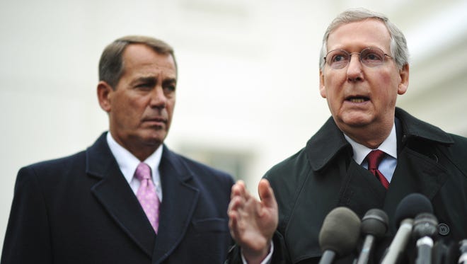 McConnell speaks alongside then-House minority leader John Boehner following a meeting with President Obama to discuss the economy and jobs on Feb. 9, 2010, outside of the West Wing of the White House.