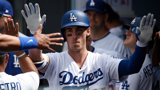 June 11: Cody Bellinger  celebrates after hitting his second homer  of the game -- a solo home run.