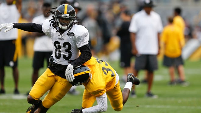 Pittsburgh Steelers wide receiver Cobi Hamilton (83) tries to avoid cornerback JaCorey Shepherd (33) on a pass route during an NFL training camp football practice, Sunday, Aug. 6, 2017, in Pittsburgh.