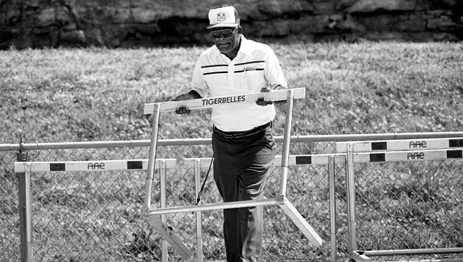 Tennessee State University famed track coach Ed Temple helps set up for the next race of the 9th annual Tigerbelle Relays April 12, 1986 on the track that bears his name.