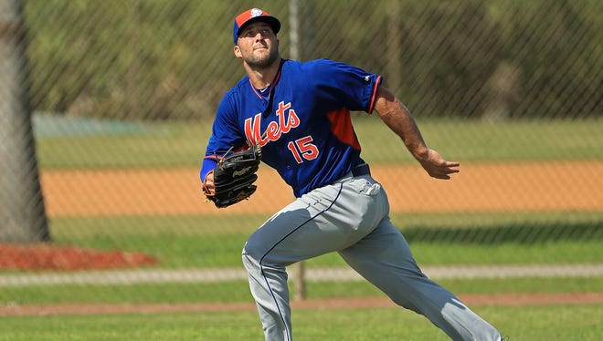 Sept. 19: Hoping to become an outfielder, Tim Tebow fields some fly balls.
